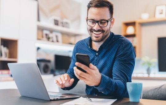 A man purchasing an item after a positive customer experience